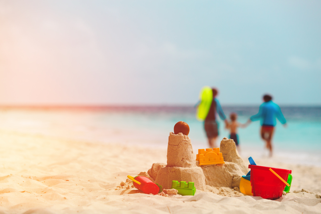 sand castle on tropical beach, family vacation