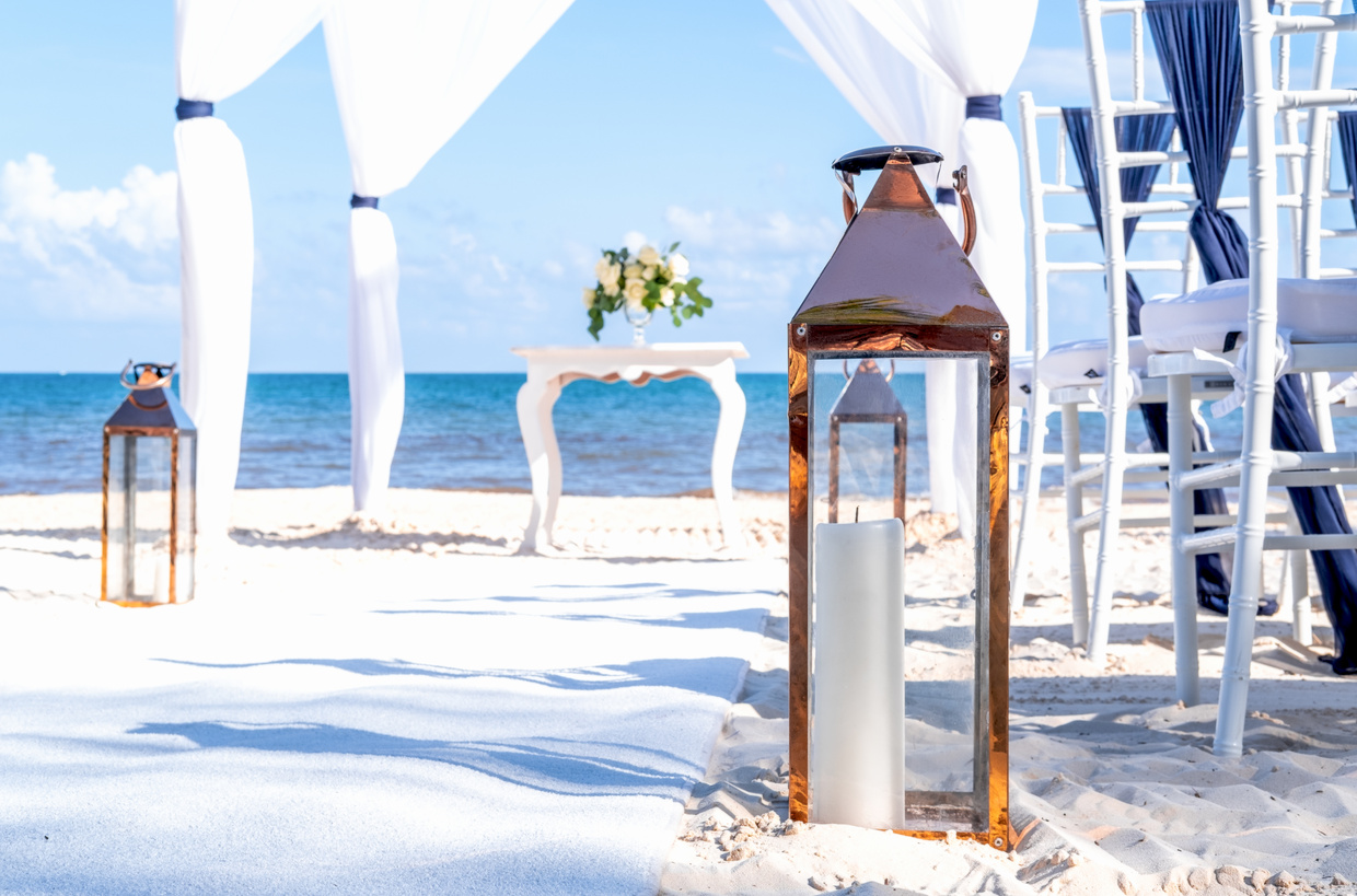 Details of blue themed wedding setup at the white sandy beach. Romantic getaway wedding