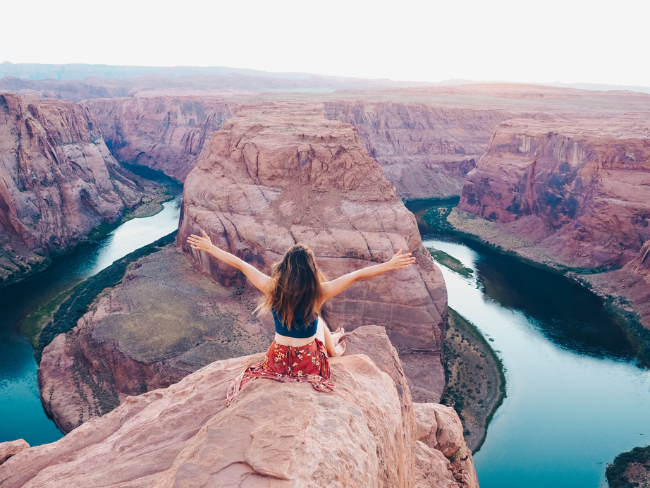 Traveler Sitting on a Cliff